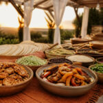 A variety of wedding food options displayed at a reception.